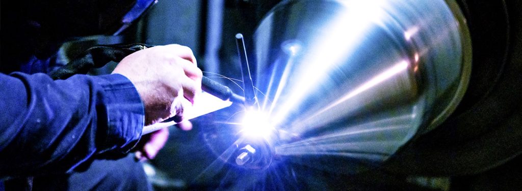 Welding a sanitary metal funnel