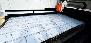 Steel blanks running through laser cutting process