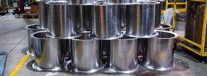 large custom cylinders with flanges stacked
