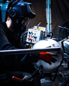 manually welding two hemispheres