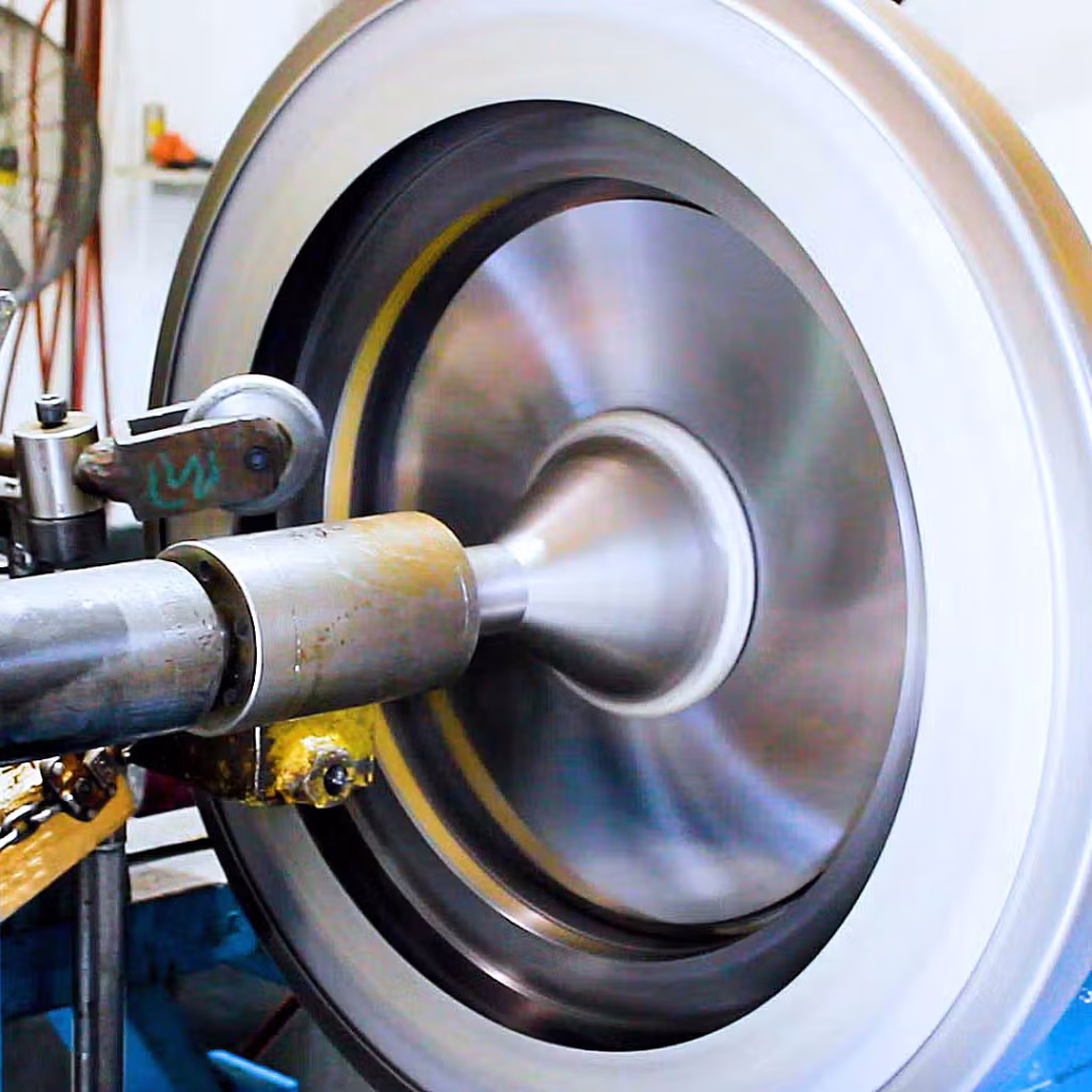manually edge rolling stainless steel on a spinning lathe
