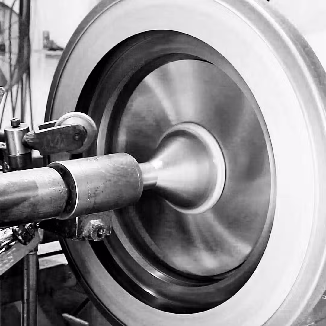 Manually forming a bead on a stainless steel spun application